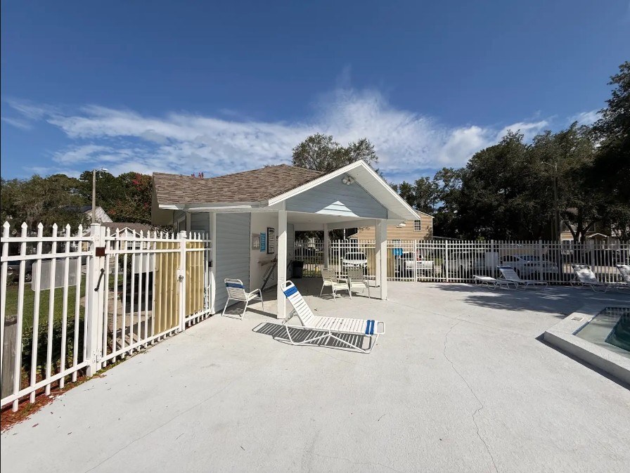 Fenced pool deck and cabana area at a Central Florida community.